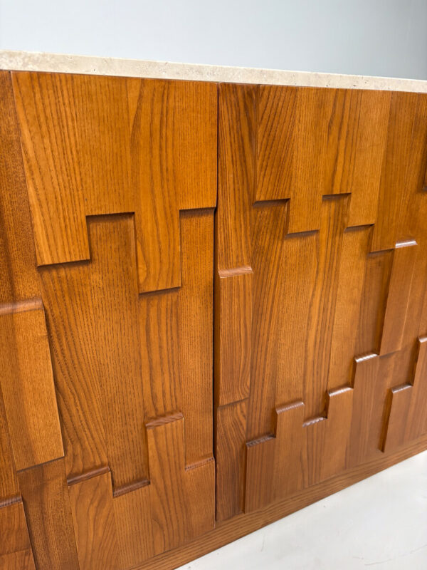 Italian Brutalist sideboard with geometric oak front and travertine top. A bold mid-century modern statement piece for luxury interio