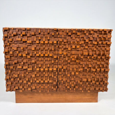 Unique Italian Brutalist sideboard with deeply carved geometric wood façade and travertine top. A bold mid-century modern design for statement interiors.