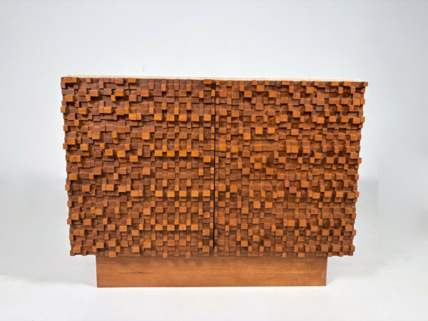 Unique Italian Brutalist sideboard with deeply carved geometric wood façade and travertine top. A bold mid-century modern design for statement interiors.