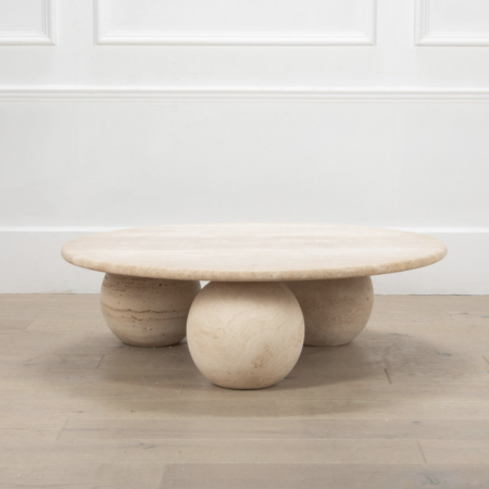 Contemporary round travertine coffee table
