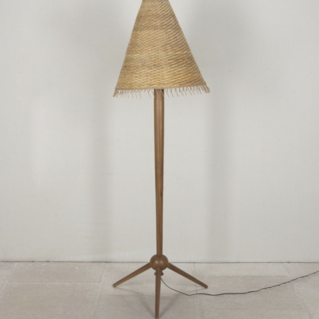 Contemporary Mid-Century French style floor lamp with rattan shade.